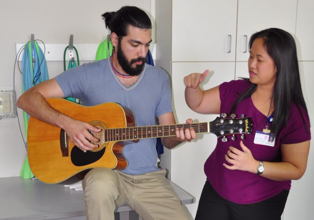Janice Ying working with patient