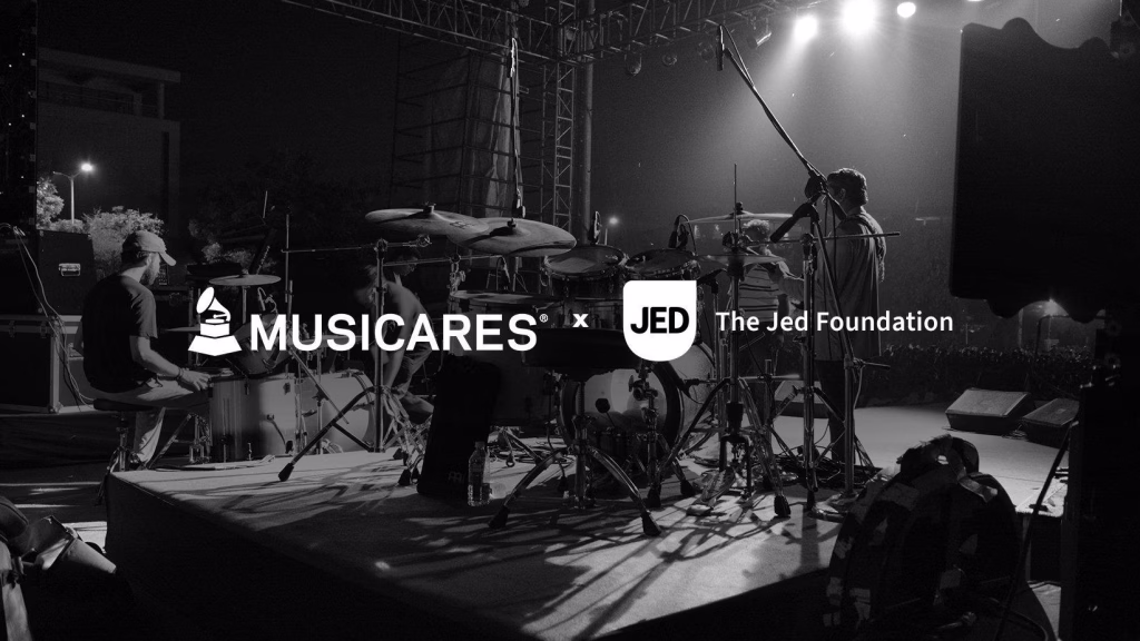 A graphic featuring a black-and-white photo of a band performing live on stage.