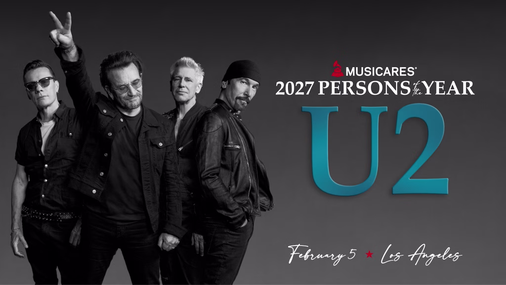 A photo of U2, the 2027 MusiCares Persons of the Year honorees. The photo features U2 members (L-R): Larry Mullen Jr., Bono, Adam Clayton, and The Edge.